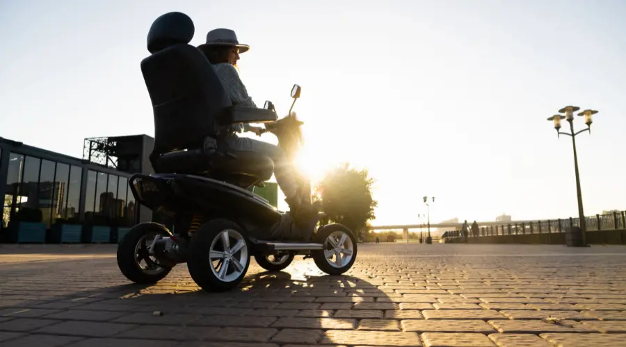 Lady Riding A Mobility Scooter